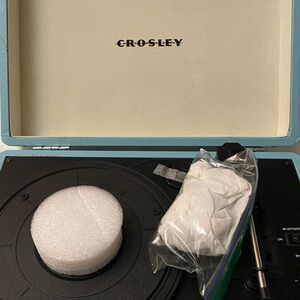 Crosley record player.  May have been used one time. Comes with a wall charger.
